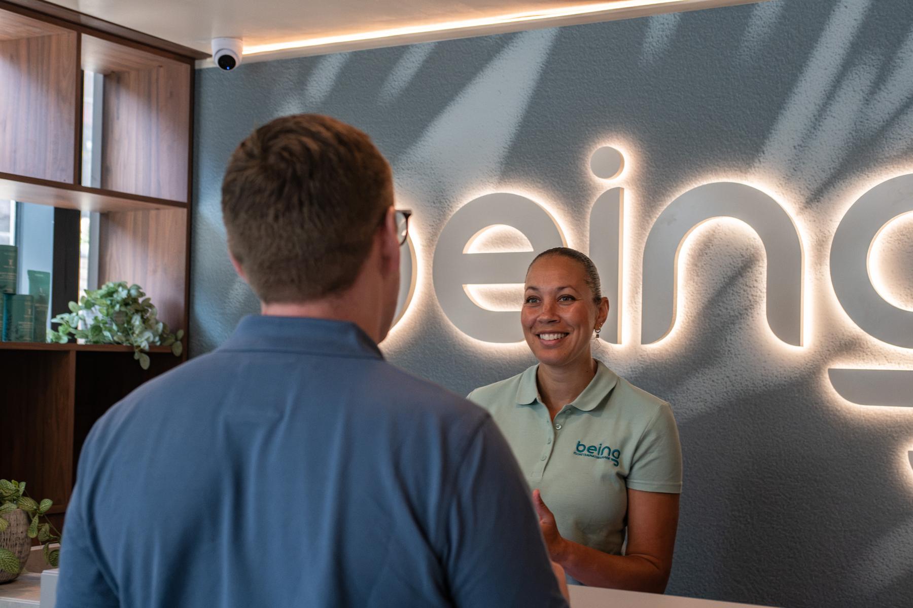 Customer being greeted in spa reception